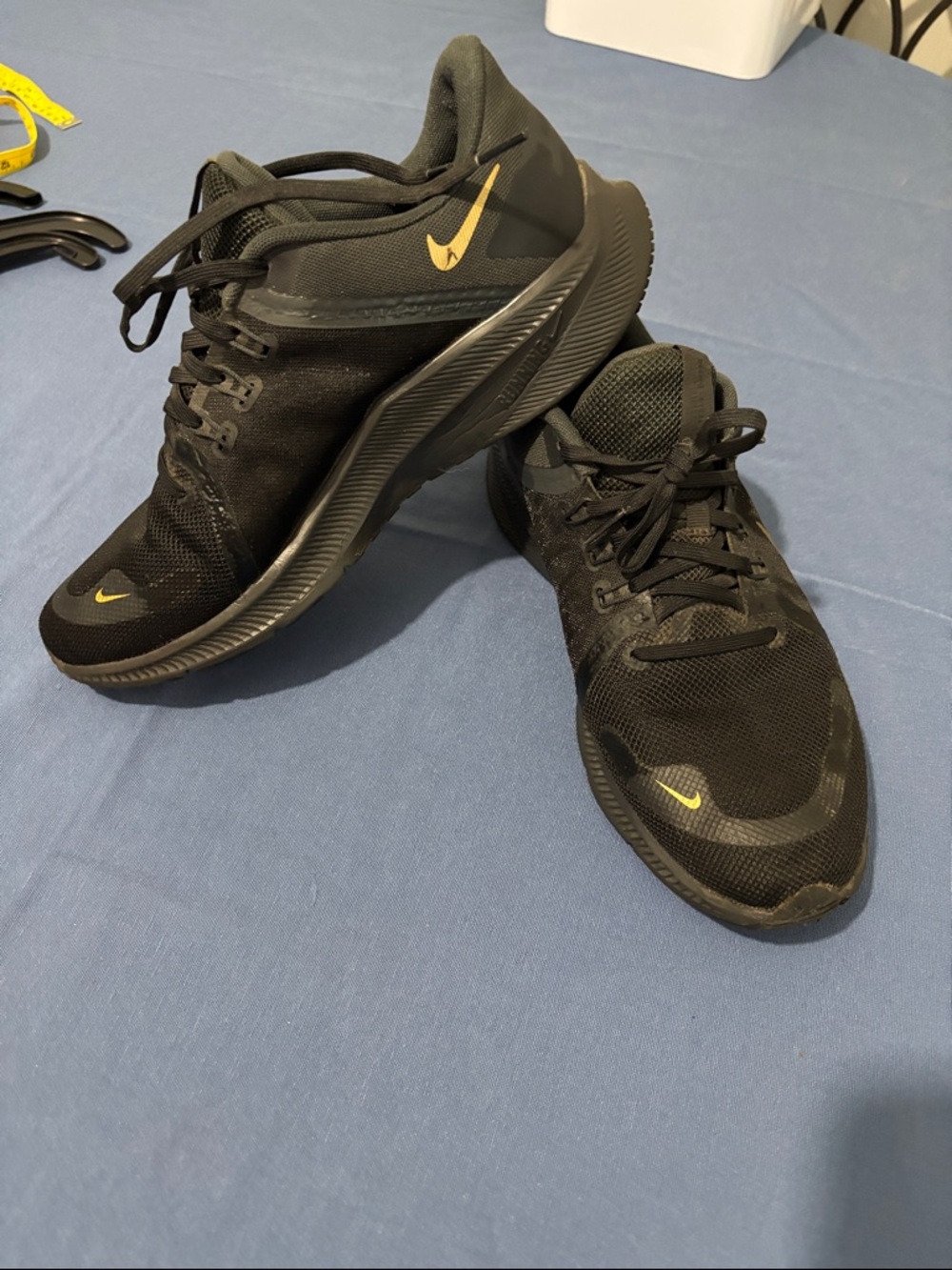 Nike Black Sneakers with Gold Swoosh
